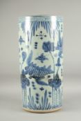 A LARGE CHINESE BLUE AND WHITE PORCELAIN STICK STAND decorated with flowers and birds. 2ft high,