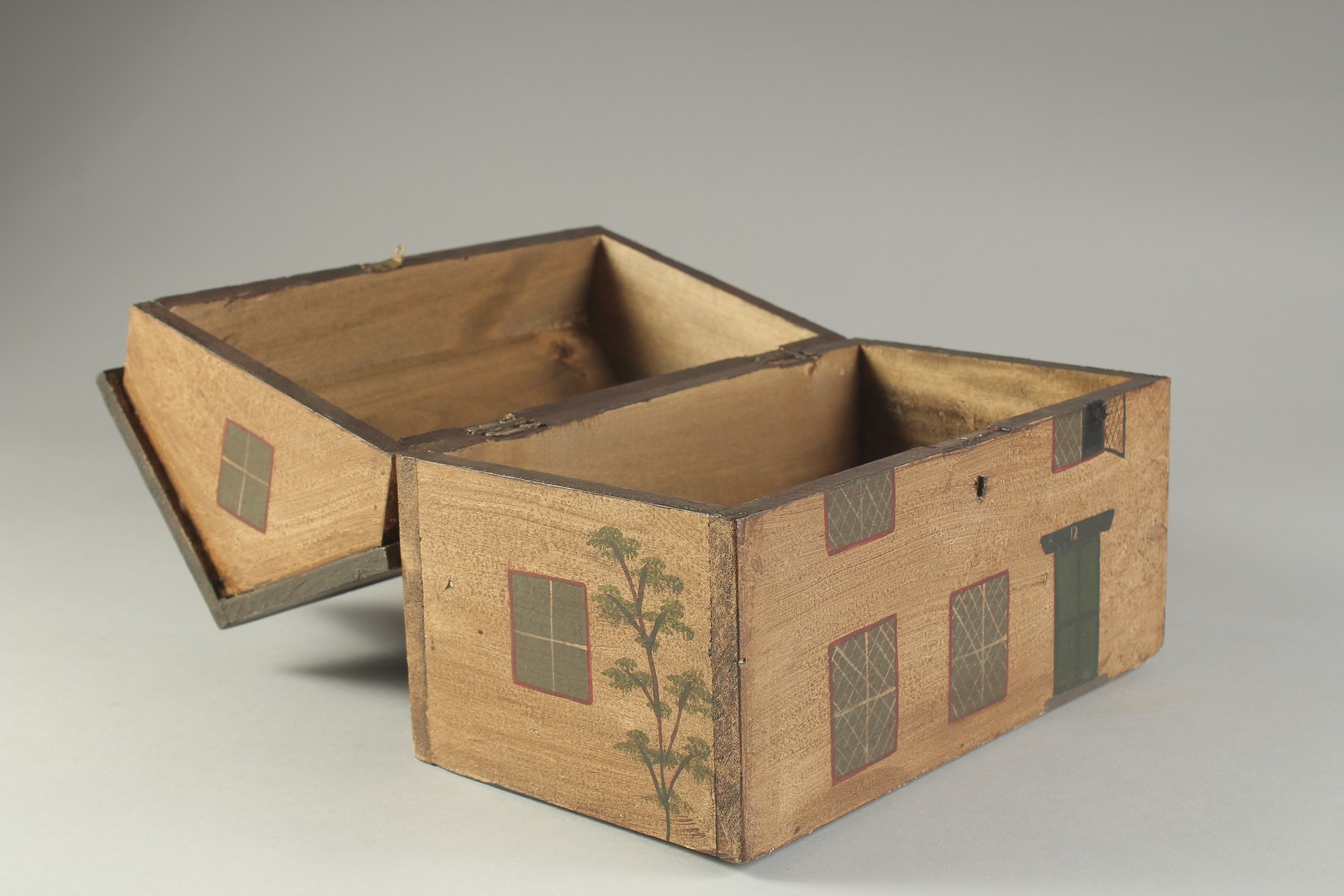 A DECORATIVE PAINTED BOX OR TEA CADDY, modelled as a cottage. 10ins long. - Image 3 of 3