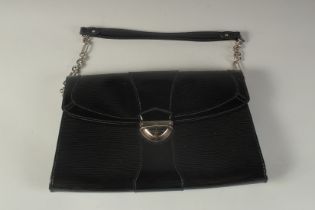 A LOUIS VUITTON BLACK PATENT HAND BAG. 12ins long.