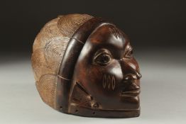 A GOOD YORUBA CARVED WOODEN MASK 10ins long.