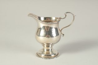 A GEORGE III CREAM JUG. London 1768. Maker: S. M.