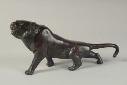 A JAPANESE BRONZE TIGER Signed 9.5ins long.