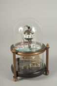A SMALL GLASS DOMED NOVELTY FISH CLOCK. 5ins high.