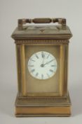 A 19TH CENTURY FRENCH BRASS CARRIAGE CLOCK with column sides. No. 6927. 5ins high.