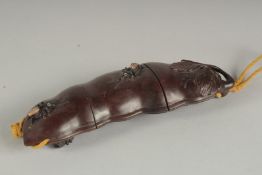 A JAPANESE CARVED WOOD THREE PIECE FRUIT AND BUG INRO on a string. 7ins long.
