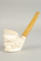 A LARGE MEERSCHAMP PIPE, the bowl, the head of an Arab, with carved stem and amber mouth piece.