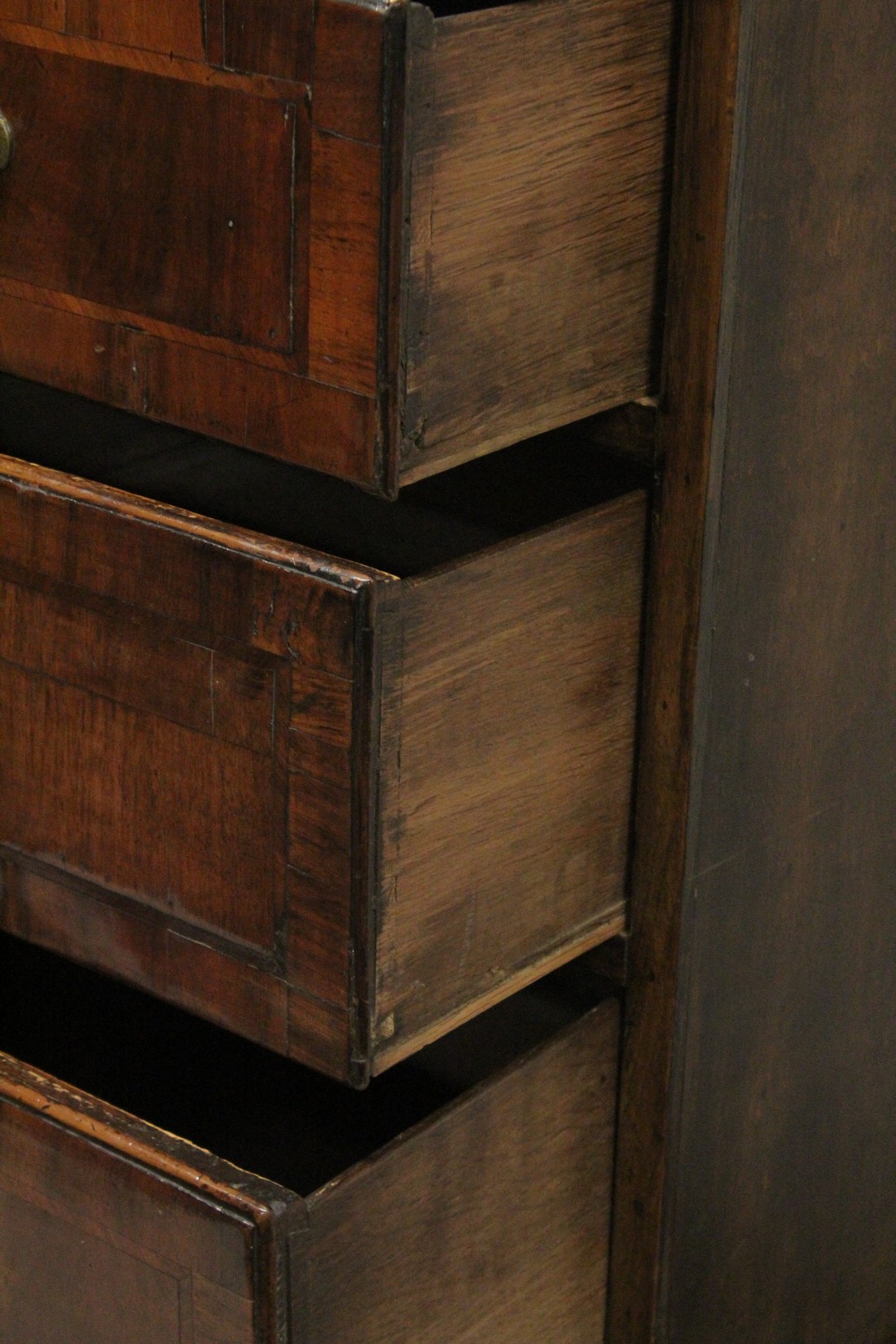 AN 18TH CENTURY OAK AND WALNUT CHEST ON STAND the top with two short and three long graduated - Image 4 of 4