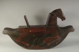 AN EARLY WOODEN ROCKING HORSE. 3ft 3ins long.