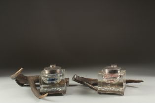 A GOOD PAIR OF VICTORIAN ANTLER INKWELLS.