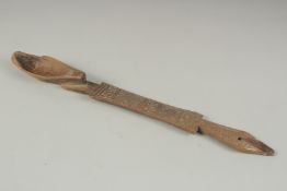A CARVED WOOD LONG SPOON. 15ins long.