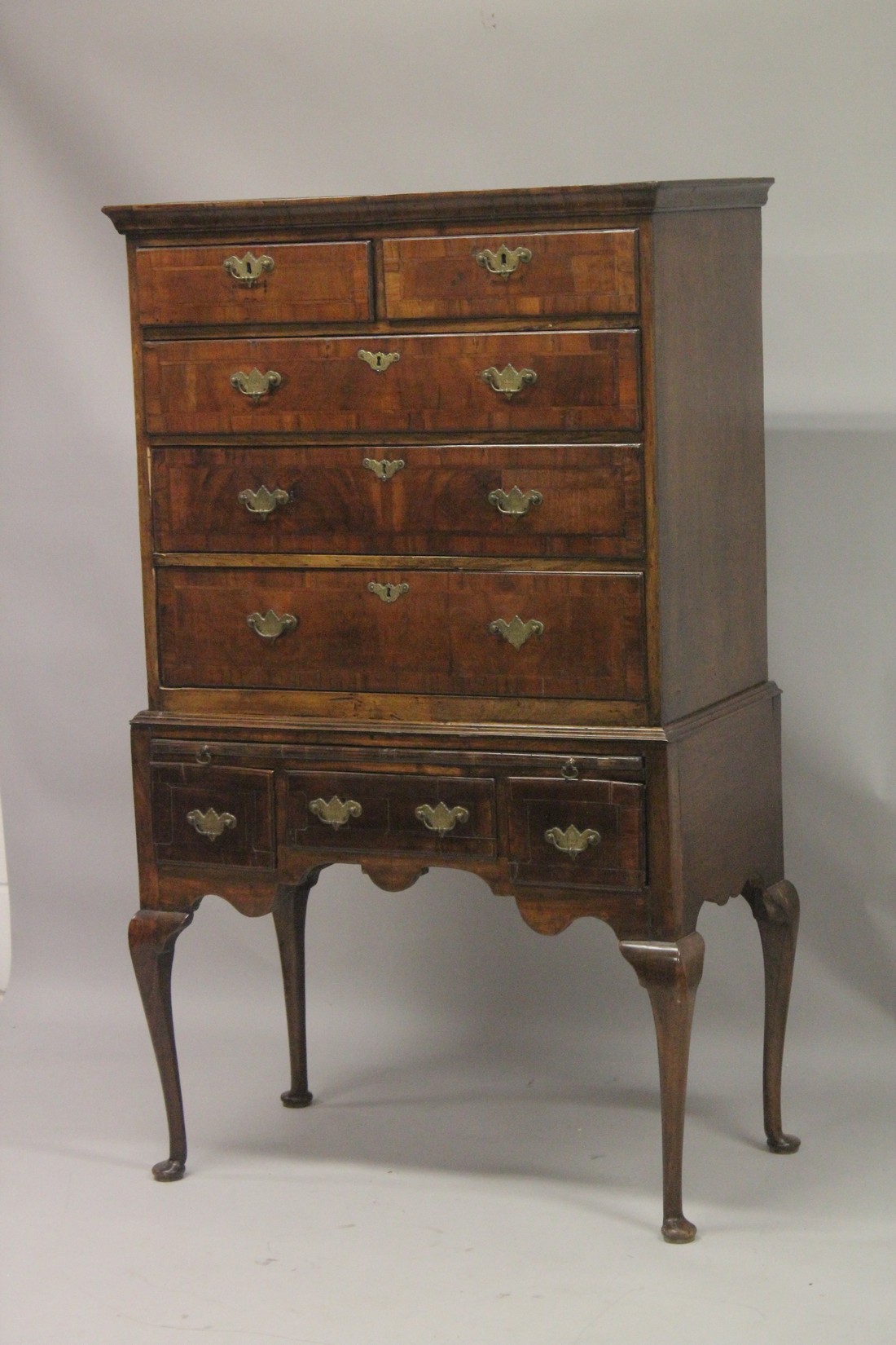 AN 18TH CENTURY OAK AND WALNUT CHEST ON STAND the top with two short and three long graduated - Image 2 of 4