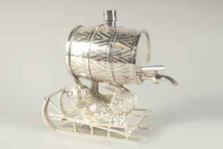 A NOVELTY SILVER PLATED LIQUEUR DISPENSER modelled as a barrel being held aloft by a bear lying on a