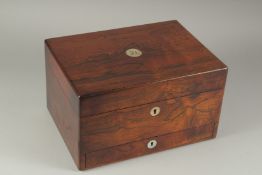 A LADIES VICTORIAN ROSEWOOD DRESSING CASE with key and fitted interior, with glass bottles. 12.