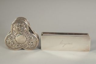 A CLOVER LEAF SILVER BOX Birmingham 1900 and a long SILVER PLATED BOX engraved Mergeau. 4.5ins