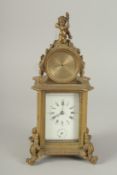 A 19TH CENTURY FRENCH BRASS CLOCK surrounded by a barometer 8ins high.