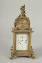 A 19TH CENTURY FRENCH BRASS CLOCK surrounded by a barometer 8ins high.