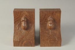 A PAIR OF MOUSEMAN OAK BOOK ENDS 6ins high, 4ins wide.