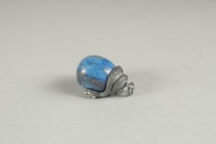 A RUSSIAN SILVER AND LAPIS EGG with a snake.