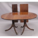 A GEORGIAN MAHOGANY 'D' END DOUBLE PILLAR DINING TABLE with two loose leaves, plain top, reeded