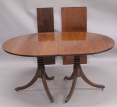 A GEORGIAN MAHOGANY 'D' END DOUBLE PILLAR DINING TABLE with two loose leaves, plain top, reeded