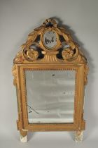 A SMALL EARLY FRENCH GILTWOOD UPRIGHT MIRROR. 2ft 3ins high, 1ft 4ins wide.