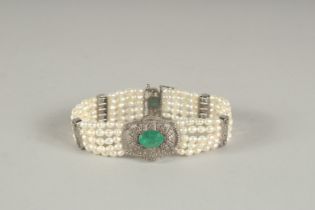 A GOOD DIAMOND, EMERALD AND FIVE ROW PEARL BRACELET.