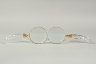 A PAIR OF CUT GLASS HANDLE MAGNIFYING GLASSES.