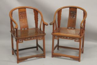 A GOOD PAIR OF CHINESE REDWOOD HOOP BACK CHAIRS with carved splats and solid seat.