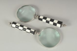 TWO CHEQUERED HANDLE MAGNIFYING GLASSES.