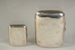 A SILVER CIGARETTE CASE with crest, Birmingham 1916, with another smaller cigarette case, Chester,