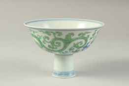 A CHINESE FAMILLE VERTE PORCELAIN STEM CUP with kui dragons. 15.5cm diameter.