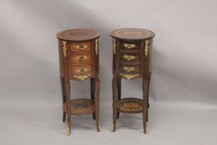 A GOOD PAIR OF LOUIS XVITH DESIGN CIRCULAR BEDSIDE TABLES fitted with four drawers with curving legs
