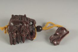 A JAPANESE HARDWOOD CRAB INRO on a rope.