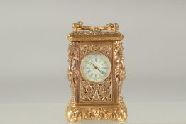 A GOOD MINIATURE CAST BRONZE CARRIAGE CLOCK the sides with caryatid figures. 2.5ins high.