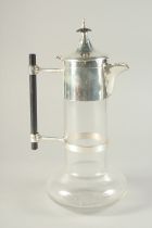 A CHRISTOPHER DRESSER STYLE CLARET JUG with plated mounts.11ins high.