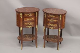 A GOOD PAIR OF LOUIS XVITH DESIGN OVAL BEDSIDE TABLES fitted with three drawers, gilt mounts,