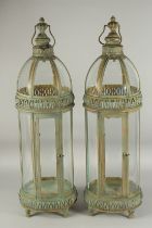 A PAIR OF TALL COPPER LANTERNS 2ft 6ins high.