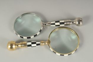 TWO MAGNIFYING GLASSES: CHROME AND GILT & CHEQUERED.