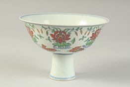 A CHINESE DONCAI PORCELAIN STEM CUP with flowers and duck. 15.5cm diameter.