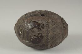 A GOOD CARVED COCONUT with animals, dated 1852. 5ins.