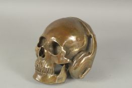 A BRONZE SKULL WITH HEADPHONES. 7ins high.
