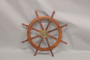 A WOODEN SHIP'S WHEEL 3ft diameter.