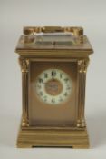 A SMALL 19TH CENTURY FRENCH BRASS REPEATER CARRIAGE CLOCK with cream dial, Roman numerals and column