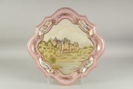 A LARGE SEVRES STYLE CABERET DISH with a castle design and vignettes f flowers. 1ft 8ins diameter.
