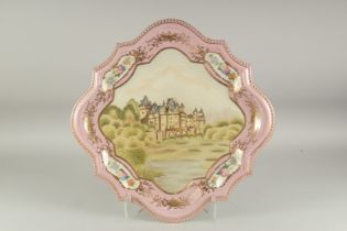 A LARGE SEVRES STYLE CABERET DISH with a castle design and vignettes f flowers. 1ft 8ins diameter.