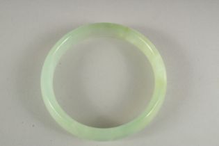 A JADE BANGLE. 2.5ins diameter.