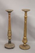 A GOOD PAIR OF GILTWOOD STANDS with circular top. 9ins diameter, fluted columns and circular