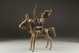 A BRASS HORSE AND RIDER, possibly Bevin. 13ins high.