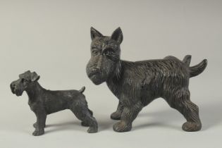 TWO CAST IRON DOGS. 7ins & 4ins.