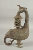 A CHINESE ARCHAIC BRONZE BIRD CENSOR. 13ins high.